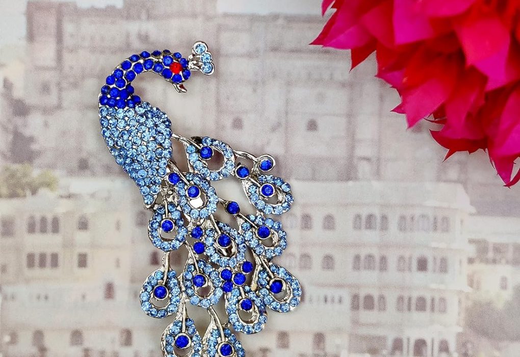 Peacock Brooch by Graff showcasing intricate gemstone details.