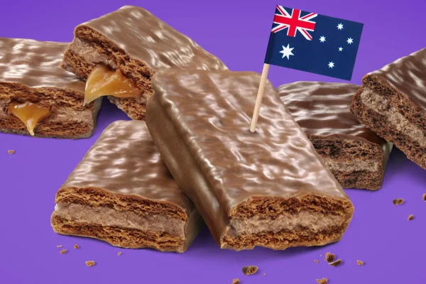 Tim Tams: Best Australian Icon, Absolutely Delicious A close-up of classic Tim Tams, featuring a crunchy biscuit with creamy chocolate filling and a smooth chocolate coating, showcasing the iconic Australian treat.