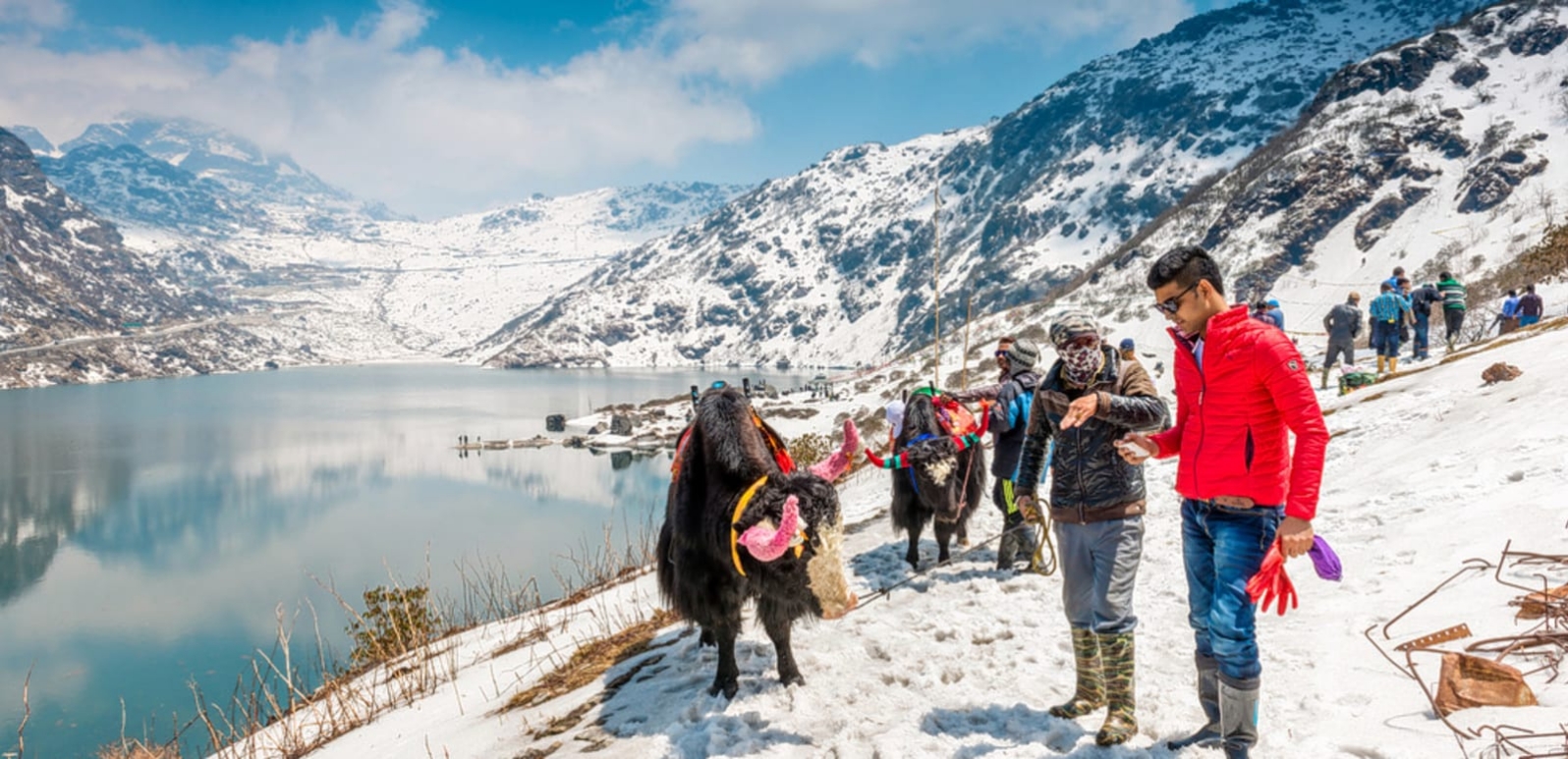 Tsomgo Lake surrounded by snow-covered mountains