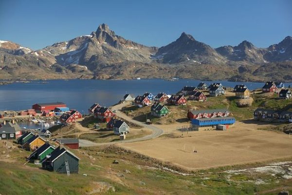 Tasiilaq: Discover the Astonishing Beauty and Culture of Eastern Greenland Panoramic view of Tasiilaq with colorful wooden houses and surrounding mountains