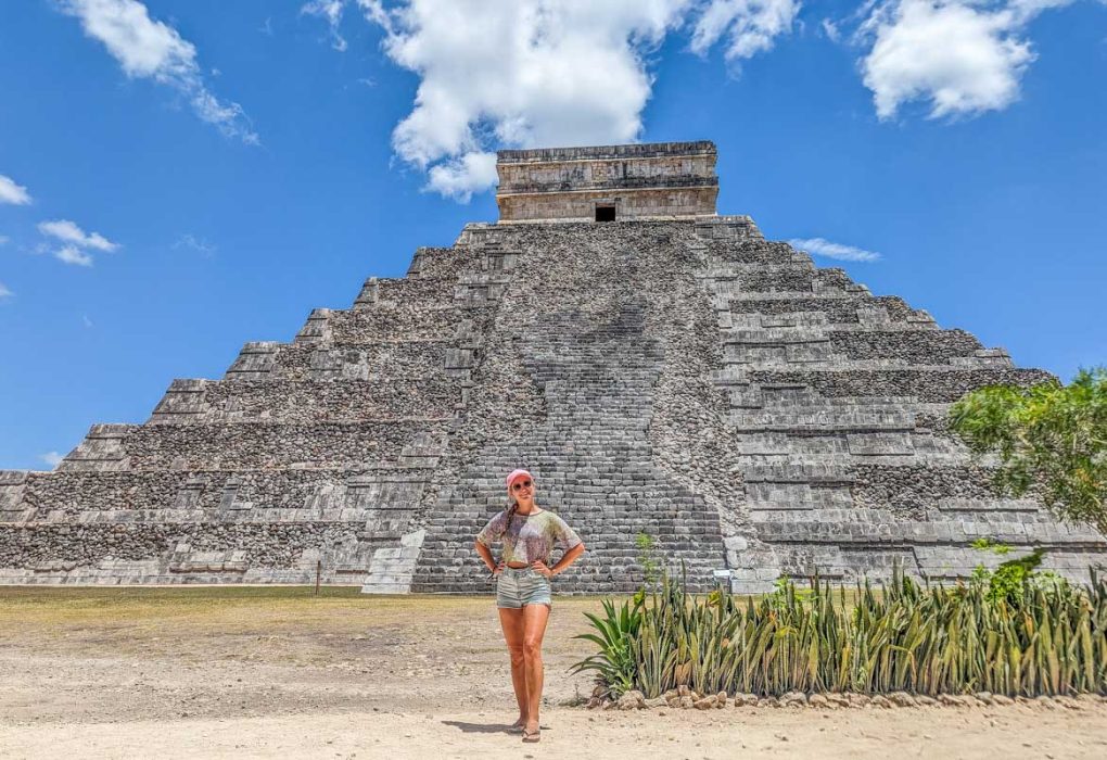 Great Ball Court at Chichen Itza with detailed carvings on the walls