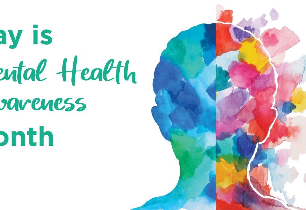 Group of people holding signs promoting mental health awareness