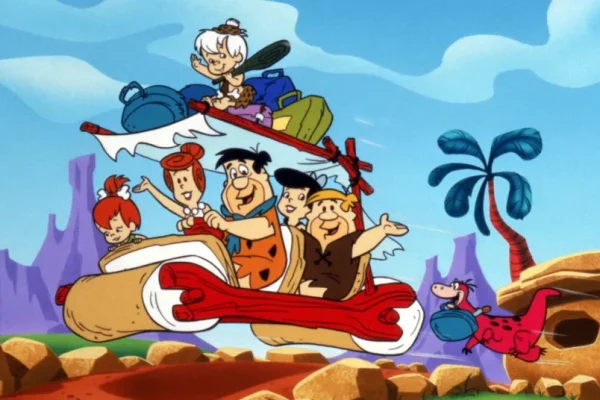 The Flintstones: Best Classic Cartoon Comedy Ever Fred Flintstone yelling "Yabba Dabba Doo!" with a big smile.
