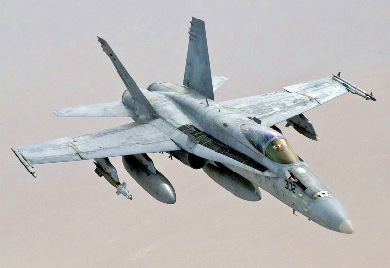F/A-18 Hornet performing aerial maneuvers during a combat mission.